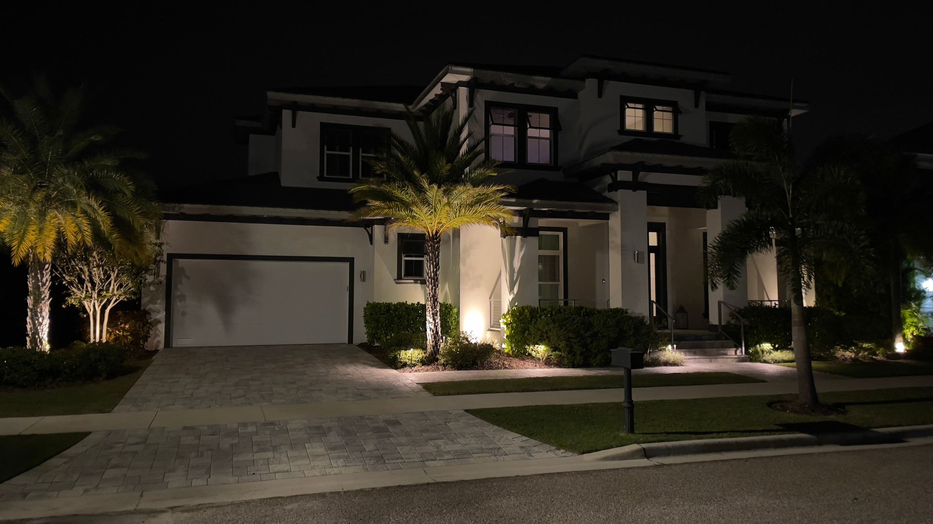 The home before its Christmas roofline and palm lights were installed.